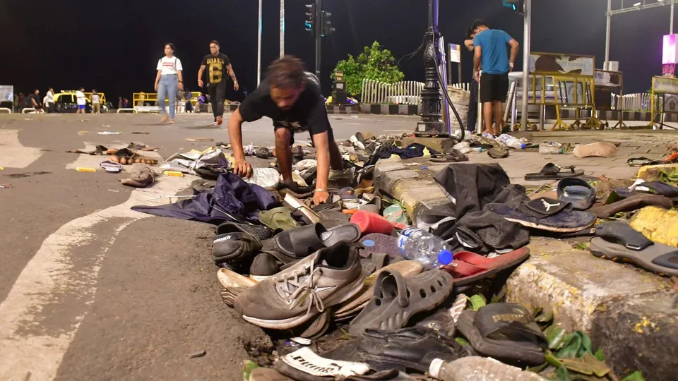 Footwears of public lying along a road near Marine Drive after the victory parade of the Indian men's team which won the T20 World Cup 2024, in Mumbai, Thursday, July 4, 2024.