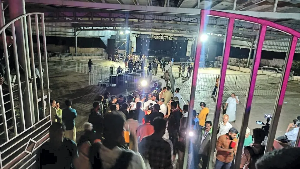 People gather near the area at Cochin University where a stampede killed at least four students and left several injured during the anniversary celebrations, in Kochi, Saturday, Nov. 25, 2023.