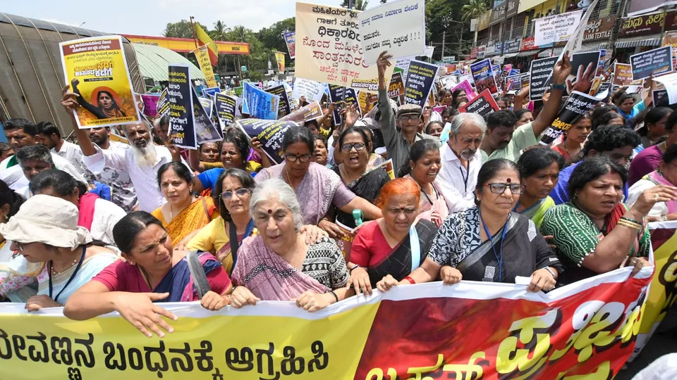 Federation of Karnataka State People's Movements members take part in a protest against JD(S) leader Prajwal Revanna over sexual assault allegeations against him, in Hassan, Thursday, May 30, 2024