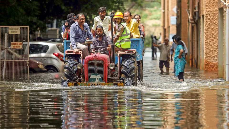 Residents of waterlogged Kendriya Vihar Apartments being shifted to a safer place after heavy rainfall, in Bengaluru, Sunday, Oct. 6, 2024.