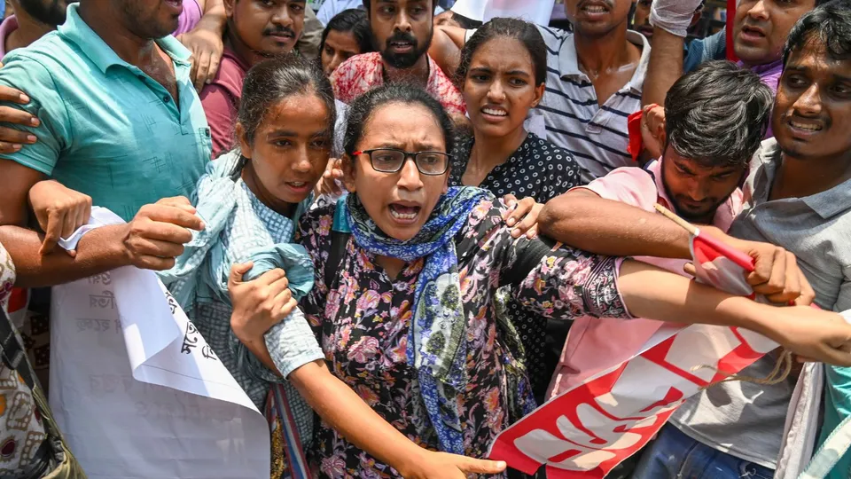 Detained members of AIDSO (All India Democratic Students' Organisation) shout slogans during their protest against the alleged irregularities in NEET-UG entrance exam result-2024, at Salt Lake area in Kolkata, Thursday, June 13, 2024.