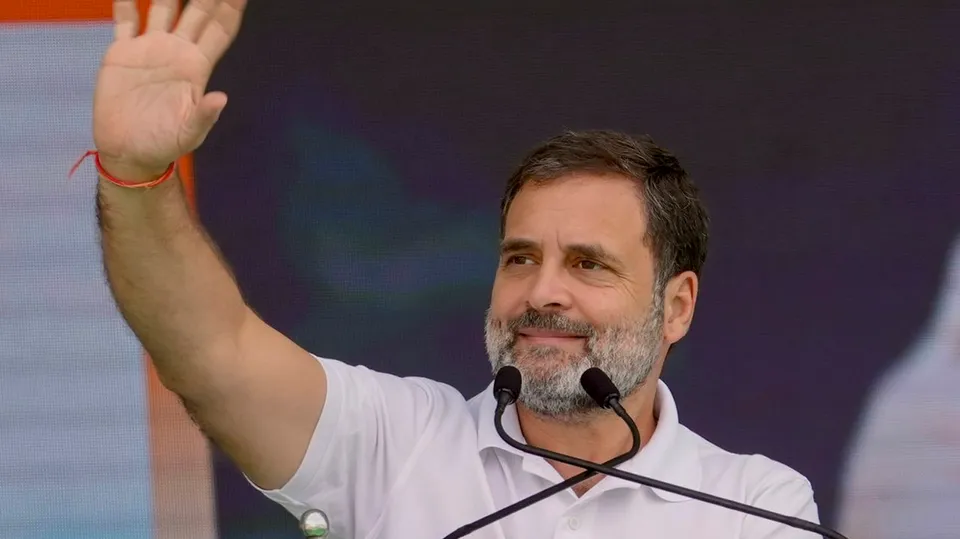 Congress leader Rahul Gandhi waves to supporters during an election rally at Bodhan ahead of Telangana Assembly polls, in Nizamabad