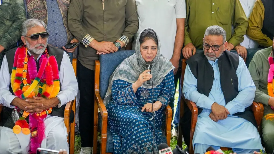 Peoples Democratic Party (PDP) President Mehbooba Mufti welcomes Gujjar leader Qamar Ali, left, and his supporters from Rajouri as they join the party, in Srinagar, Wednesday, Aug. 21, 2024.