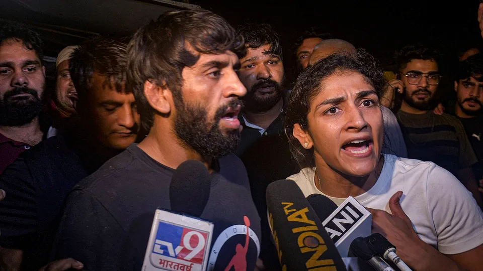 Wrestlers Bajrang Punia and Sangita Phogat talk to the media after an scuffle between wrestlers and the police at Jantar Mantar on May 3