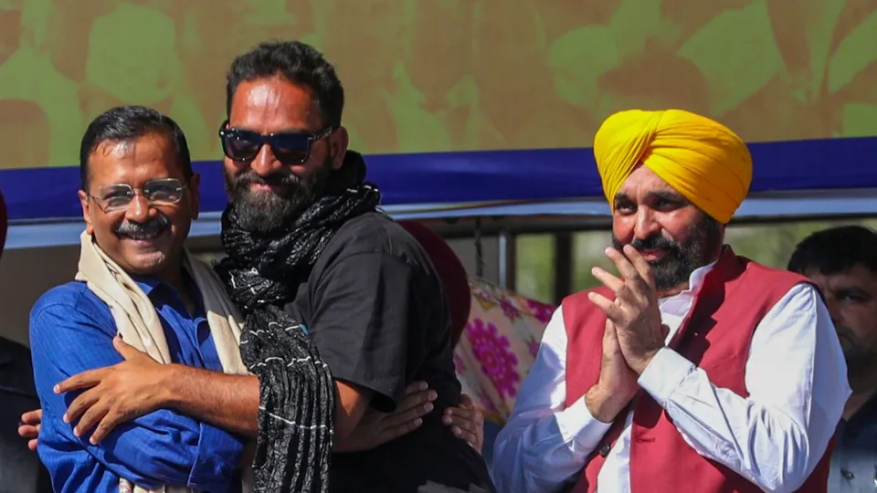 AAP National Convener Arvind Kejriwal and Bhagwant Mann with newly elected party MLA Mehraj Malik, in Doda district, Jammu & Kashmir, Sunday, Oct. 13, 2024.