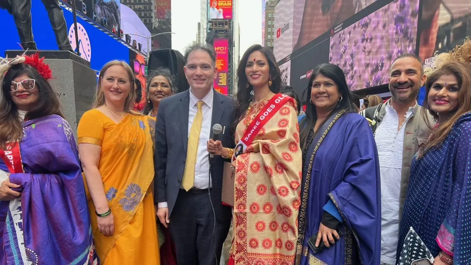 Members of the Indian-American community with others during 'Saree Goes Global' event at Times Square, in New York