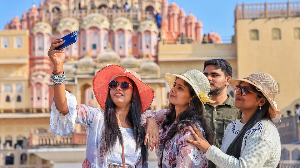 Tourists visit the historical Hawa Mahal during the Christmas and New year celebrations, at Badi Chaupar, in Jaipur