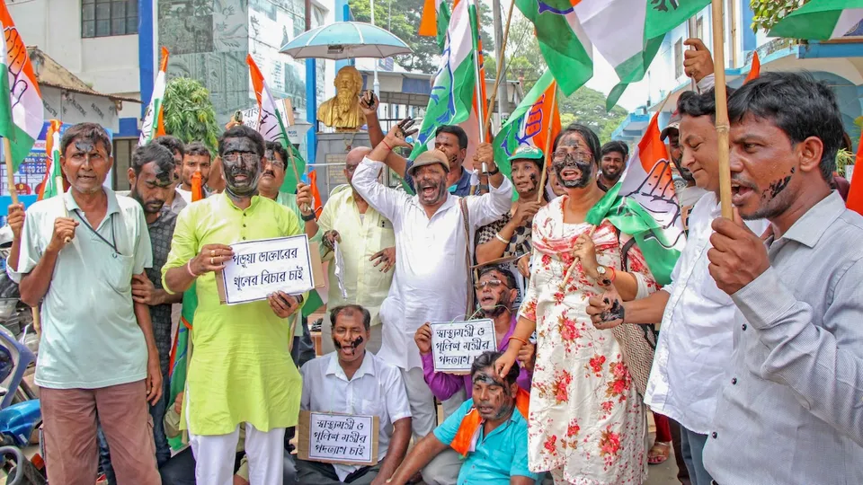 Congress activists raise slogans during a protest against the recent alleged rape and murder of a trainee doctor at Kolkata's RG Kar Medical College and Hospital, in Birbhum district, Wednesday, Aug. 14, 2024