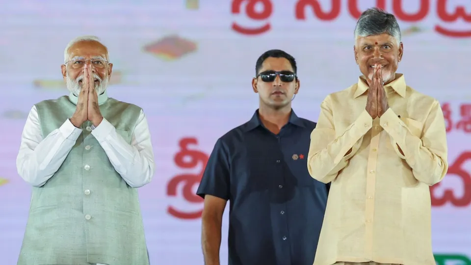 Prime Minister Narendra Modi with TDP supremo and Andhra Pradesh Chief Minister-designate N Chandrababu Naidu at the latter's swearing-in ceremony, in Amaravati, Wednesday, June 12, 2024.