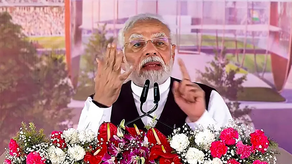 Prime Minister Narendra Modi speaks during the foundation stone laying ceremony of an international cricket stadium, in Varanasi