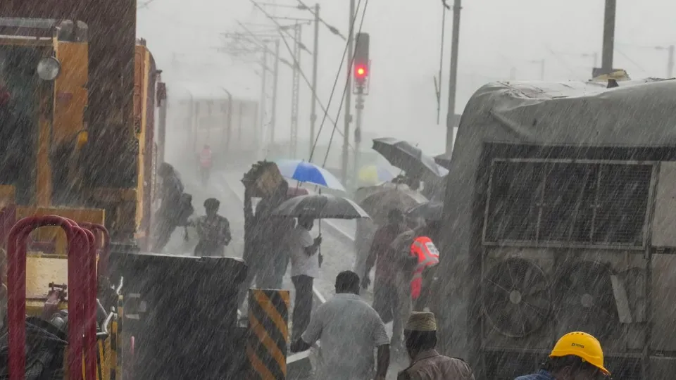 Restoration work underway after Mysuru-Darbhanga Bagmati Express train rammed into a stationary goods train on Friday, amid rain, at Kavaraipettai near Chennai, Saturday, Oct. 12, 2024