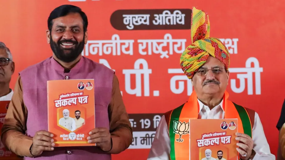 Union Minister and BJP National President JP Nadda with Haryana Chief Minister Nayab Singh Saini releases party's manifesto for the State Assembly elections, in Rohtak, Haryana, Thursday, Sept. 19, 2024.