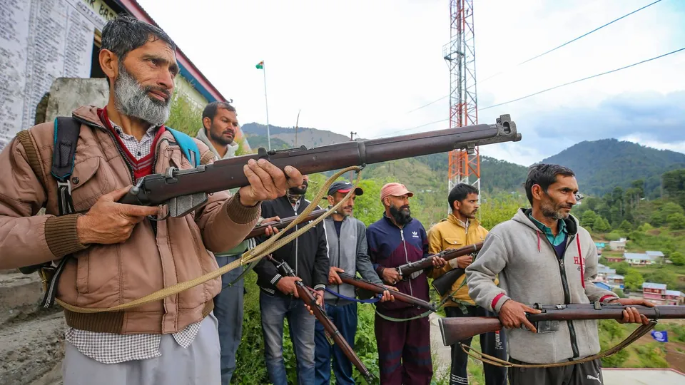 Village Defence Guards members stand guard after a VDG member Mohammad Sharif was killed while fighting terrorists in the Basantgarh area, in Udhampur district, Sunday, April 28, 2024