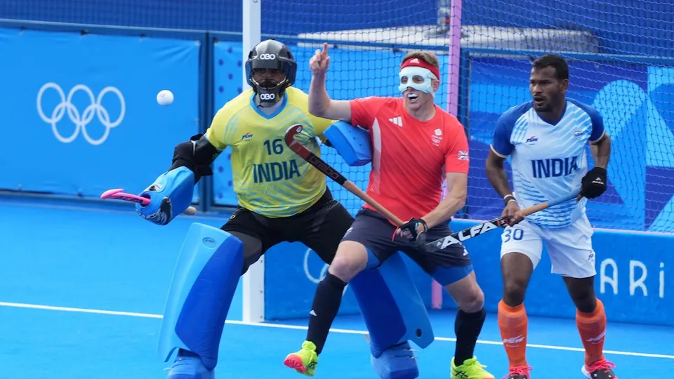 India's goalkeeper PR Sreejesh (16) and Amit Rohidas (30) in action during the Hockey Men's Quarterfinal match between India and Great Britain at the 2024 Summer Olympics, at Yves-du-Manoir Stadium, in Colombes, France, Sunday, Aug. 4, 2024.