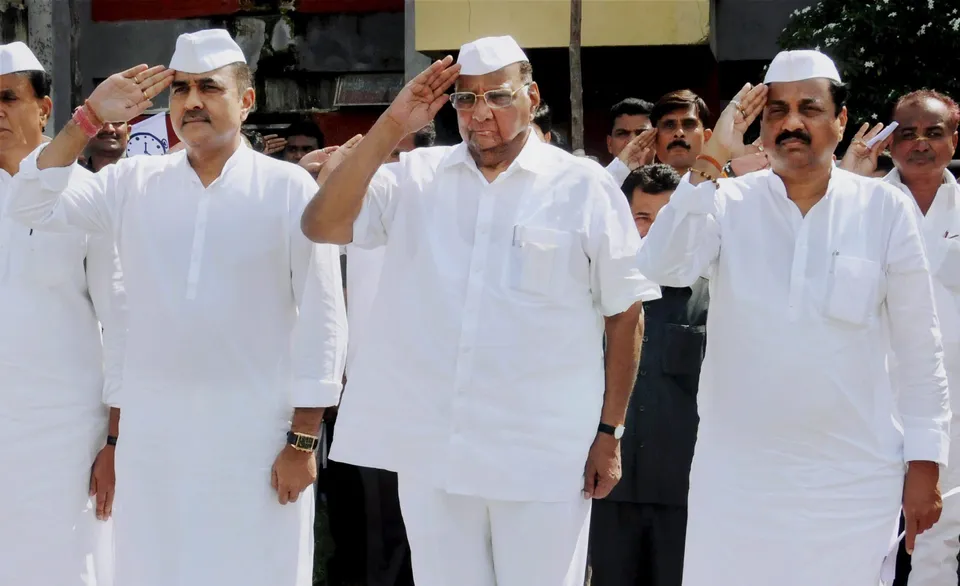 In this Thursday, July 10, 2016, file photo, Nationalist Congress Party (NCP) President Sharad Pawar with party leaders Praful Patel and Sunil Tatkare
