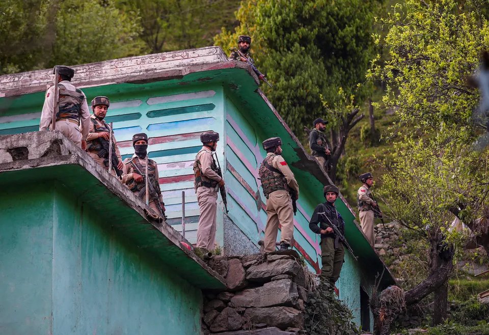 Security personnel near the site of an encounter with terrorists in Kandi area of Rajouri