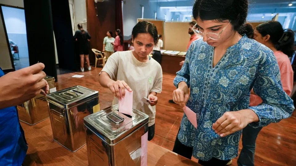Students cast their votes during the Delhi University Students' Union (DUSU) polls 2024, at Miranda House college, in New Delhi, Friday, Sept 27, 2024. 