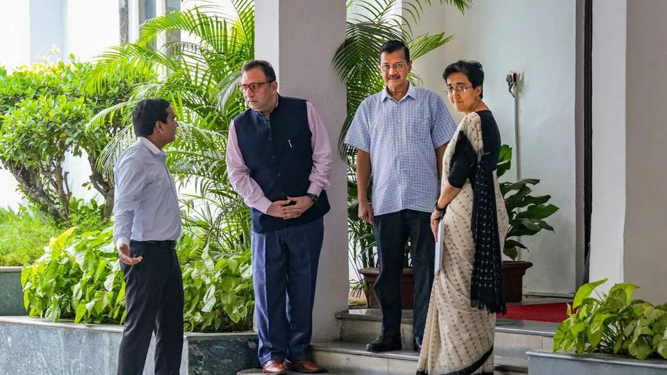 AAP convenor and Delhi Chief Minister Arvind Kejriwal with Minister Atishi
