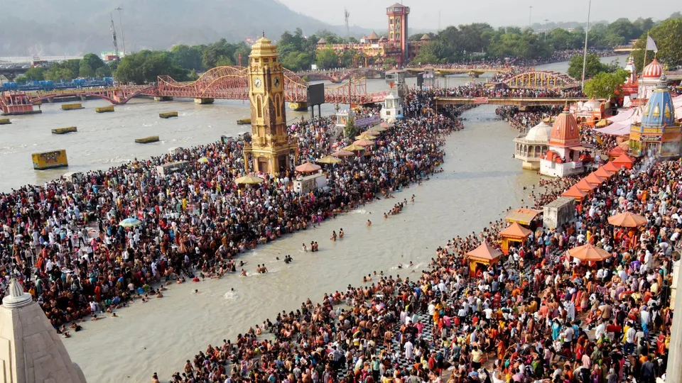 Devotees gather to take a holy dip in the Ganga river on the occasion of Ganga Dussehra, at Har ki Pauri, in Haridwar, Sunday, June 16, 2024.