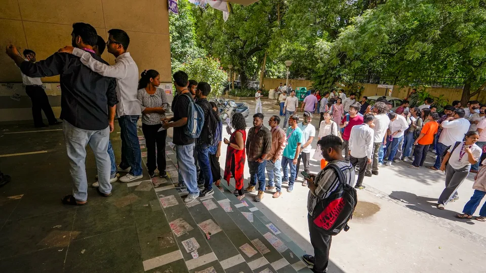 Students stand in a queue at a polling booth to cast their votes during the Delhi University Students' Union (DUSU) polls 2024, at Campus Law Centre, in New Delhi, Friday, Sept 27, 2024.