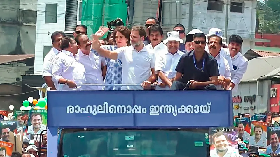 Congress candidate Rahul Gandhi with party leaders Priyanka Gandhi and K.C. Venugopal during a road show before filing his nomination papers for the upcoming Lok Sabha elections, in Wayanad district, Wednesday, April 3, 2024
