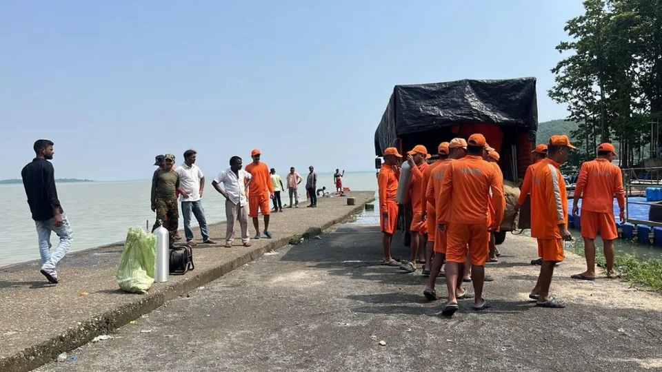 NDRF personnel preparing for a search operation in the lake