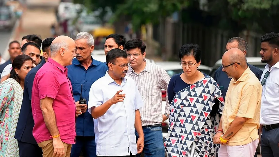 Delhi Chief Minister Atishi with former chief minister Arvind Kejriwal and former deputy chief minister Manish Sisodia inspects roadwork in the Delhi University area, in New Delhi, Thursday, Sept. 26, 2024.