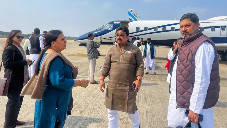MLAs of the JMM-led alliance in Jharkhand board a flight for Hyderabd, in Ranchi, Friday, Feb. 2, 2024.