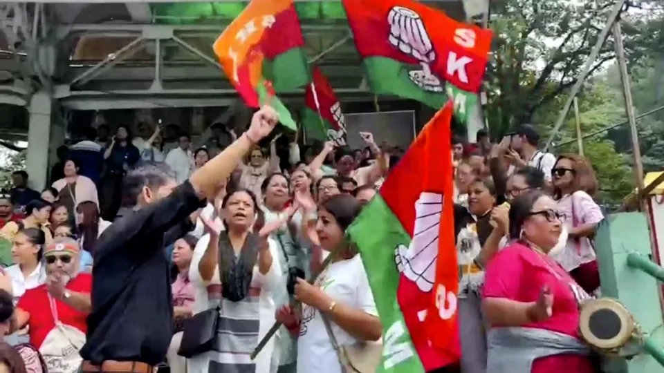 Sikkim Krantikari Morcha (SKM) members celebrate their lead in the Assembly polls, outside a counting centre, in Gangtok, Sunday, June 2, 2024