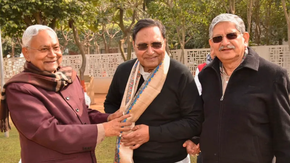 Bihar Chief Minister Nitish Kumar greets former Bihar BJP vice-president Rajeev Ranjan as he joins the Janta Dal (United) in Patna on Sunday