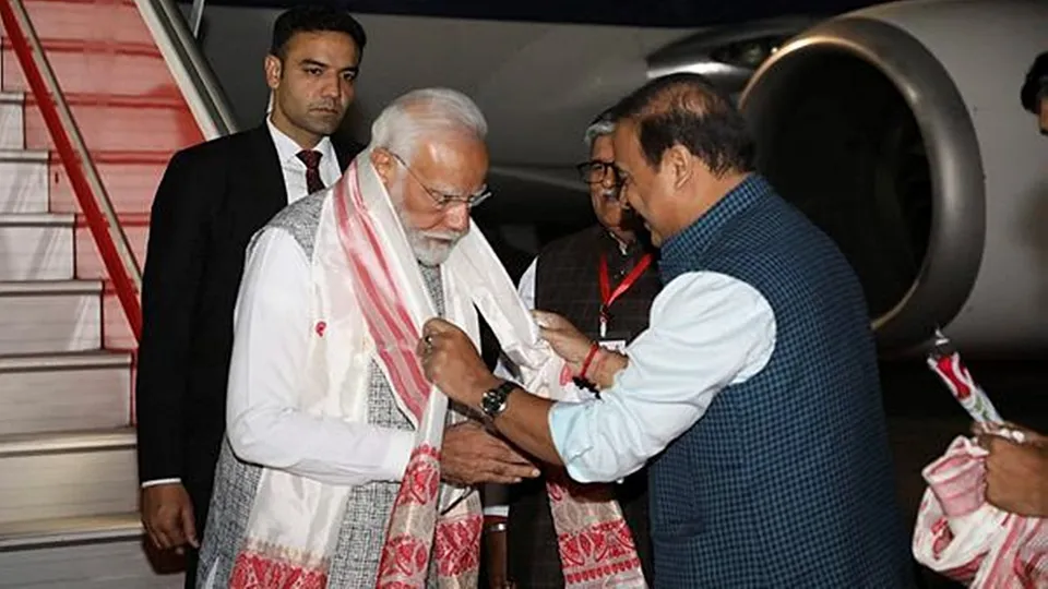 Prime Minister Narendra Modi being received by Assam Chief Minister Himanta Biswa Sarma on his arrival, at the LGBI Airport in Guwahati.