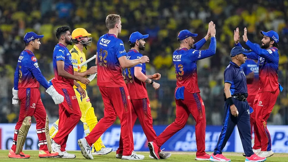 Royal Challengers Bengaluru's bowler Cameron Green with teammates celebrates the wicket of Chennai Super Kings' batter Daryl Mitchell during the Indian Premier League (IPL) 2024 cricket match between Chennai Super Kings and Royal Challengers Bengaluru at MA Chidambaram Stadium, in Chennai, Friday, March 22, 2024.