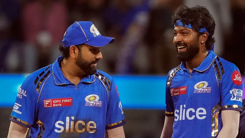 Mumbai Indians captain Hardik Pandya and Rohit Sharma during the IPL match against Royal Challengers Bengaluru and Mumbai Indians at Wankhede Stadium in Mumbai, Thursday, April 11, 2024