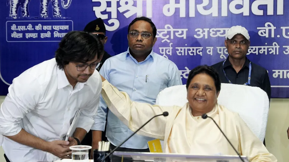BSP supremo Mayawati with her brother Anand Kumar and nephew Akash Anand during party's office bearers' meeting to review results of general elections, at party office in Lucknow, Sunday, June 23, 2024.