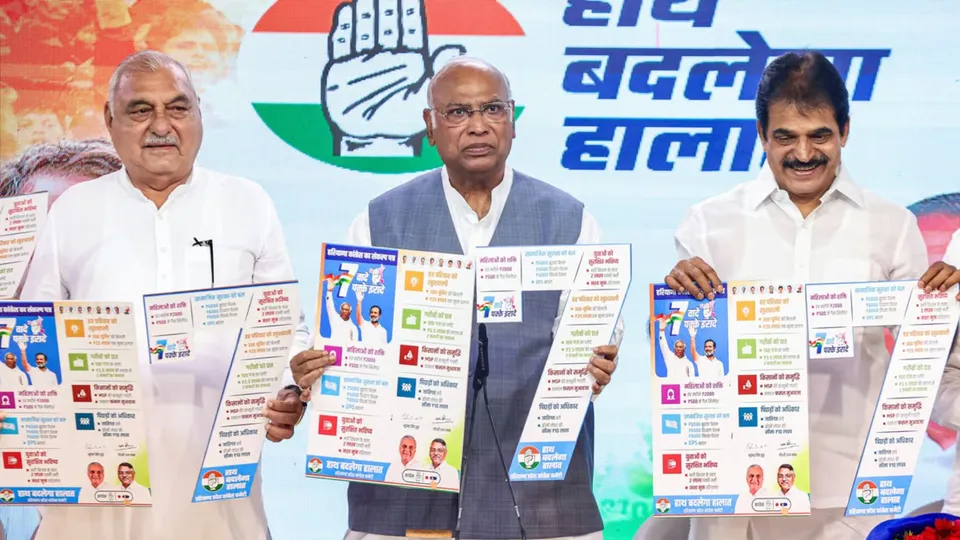 Congress President Mallikarjun Kharge with party's senior leaders K C Venugopal and Bhupinder Singh Hooda launching poll-manifesto
