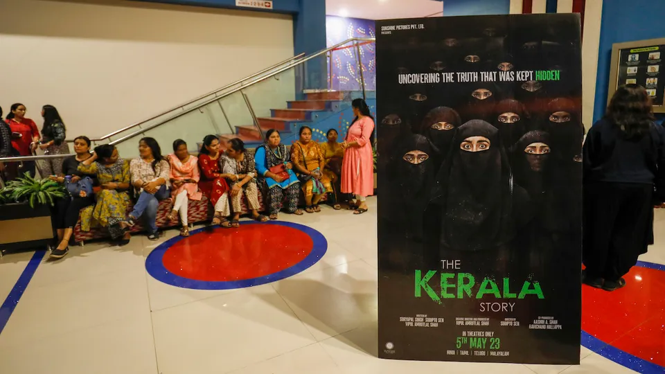 Women wait at a cinema hall to watch the 'The Kerala Story' film in Ahmedabad, Saturday, May 6