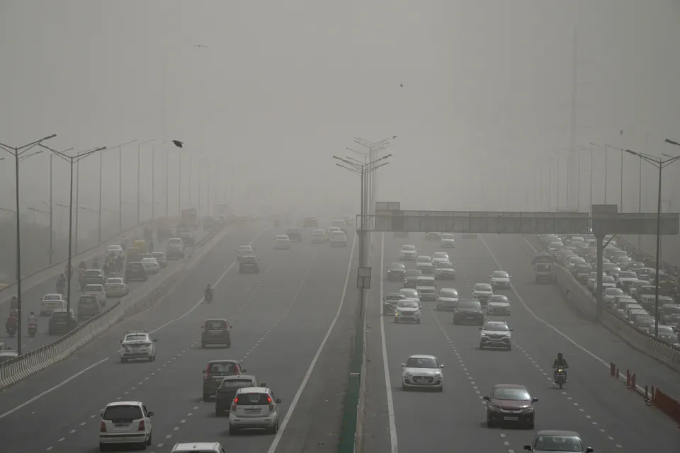 Vehicles ply on a road as the air quality deteriorates due to dust pollution, in New Delhi, Tuesday morning