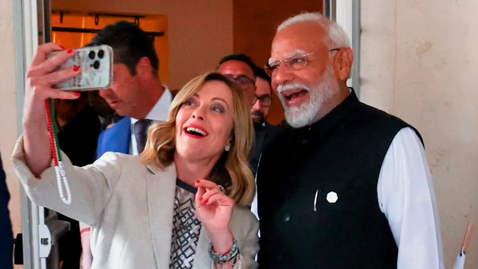 Prime Minister of Italy Giorgia Meloni takes a selfie with Prime Minister Narendra Modi on the sidelines of the G7 summit, in Apulia, Italy, Friday, June 14, 2024.