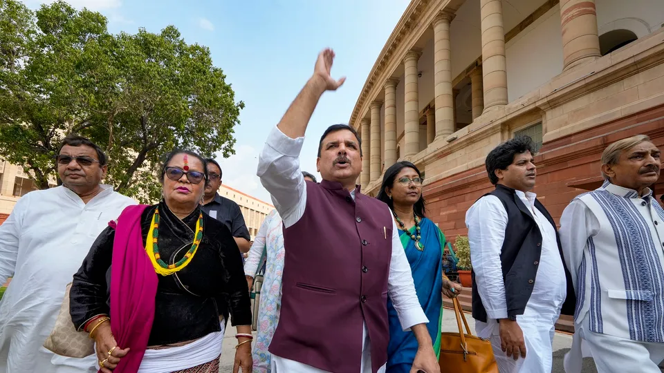 AAP MP Sanjay Singh with TMC MP Shanta Chhetri and others comes out of the Parliament House during Monsoon session, in New Delhi