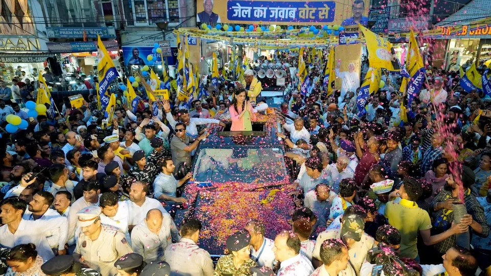 Jailed Delhi Chief Minister Arvind Kejriwal's wife Sunita Kejriwal greets supporters during an election roadshow in support of Aam Aadmi Party's (AAP) candidate from West Delhi constituency Mahabal Mishra for the Lok Sabha polls, in New Delhi.