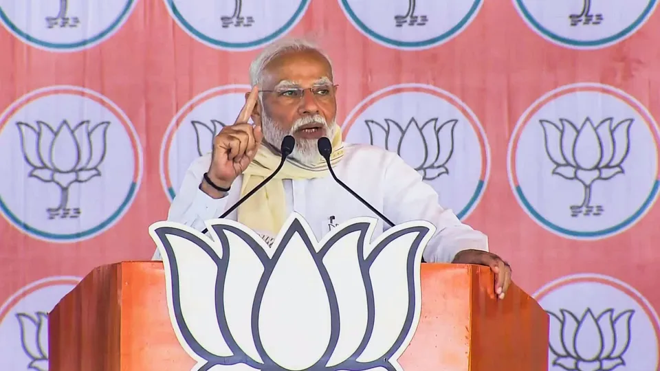 Prime Minister Narendra Modi addresses a public meeting during a public meeting organised as part of BJP campaign for the Lok Sabha elections, in Amroha, Friday, April 19, 2024