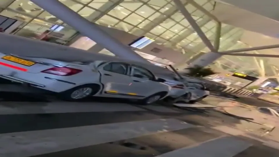 Vehicles crushed after a portion of the roof of the Delhi airport's Terminal-1 collapsed amid heavy rain, early Friday, June 28, 2024. One person died and five were injured in the collapse.