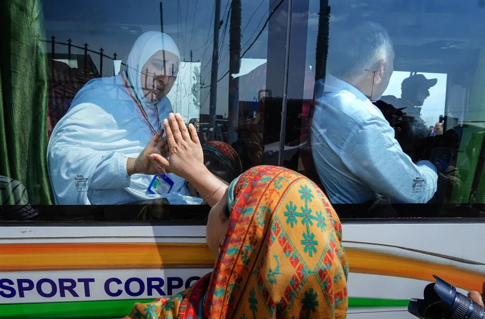 A Haj pilgrim bid goodbye to her relative as she leaves for the annual pilgrimage to Mecca, from Haj House, at Bemina, in Srinagar