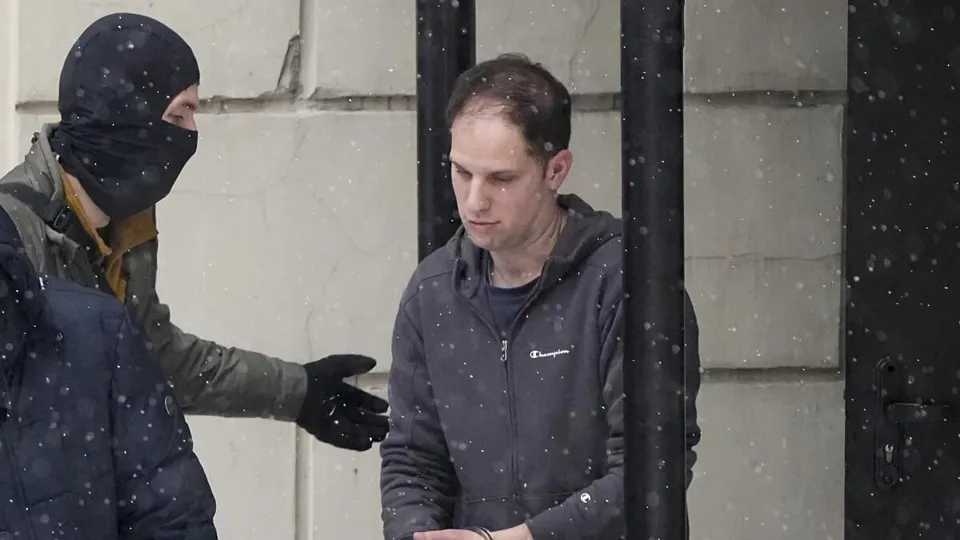 Wall Street Journal reporter Evan Gershkovich is escorted from a court hearing in Moscow, Russia, on Friday, Jan. 26, 2024. 