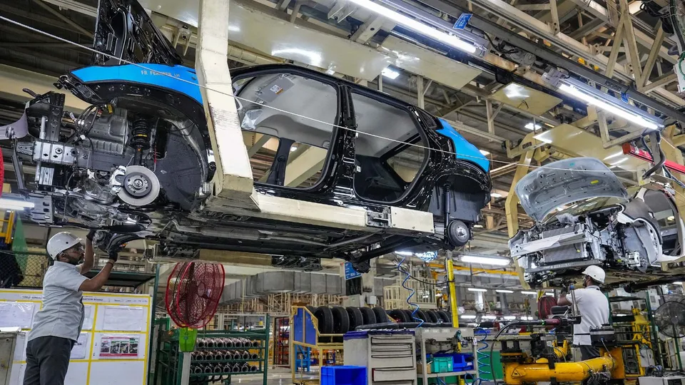 Employees work in an assembly line at the joint manufacturing facility of Renault-Nissan Automotive India Pvt Ltd, near Chennai, Wednesday, March 27, 2024