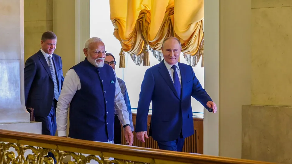 Prime Minister Narendra Modi and Russian President Vladimir Putin arrive for a meeting at the Kremlin, in Moscow, Russia.