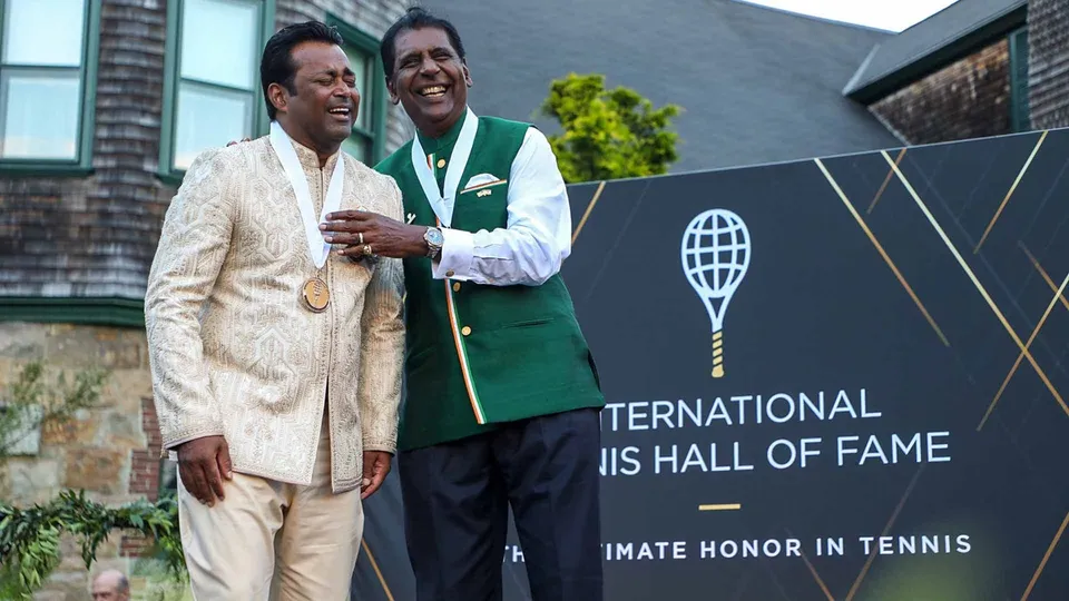 Leander Paes and Vijay Amritraj share a laugh following their induction into the International Tennis Hall of Fame