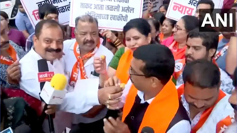 Shiv Sena workers celebrate as Badlapur sexual assault accused was shot dead by police.