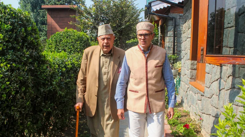 Jammu & Kashmir National Conference (JKNC) President Farooq Abdullah with his son and party Vice President Omar Abdullah, in Srinagar, Wednesday, Oct. 9, 2024.