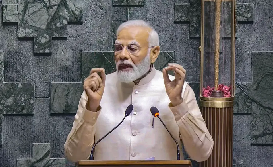 Prime Minister Narendra Modi addresses a gathering inside the Lok Sabha chamber, at the new Parliament building in New Delhi